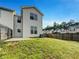 Exterior view of a well-maintained backyard with a lawn and fence providing privacy at 2399 Coach Way, Jonesboro, GA 30236