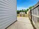 Small concrete backyard patio area with wood fence for privacy at 2399 Coach Way, Jonesboro, GA 30236