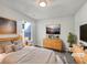 Staged bedroom showcasing natural light, neutral walls, and light wood furniture at 2399 Coach Way, Jonesboro, GA 30236