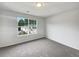Well-lit bedroom with a large window providing plenty of natural light at 2399 Coach Way, Jonesboro, GA 30236