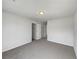 Empty bedroom with gray carpet, white walls, and a closet at 2399 Coach Way, Jonesboro, GA 30236