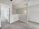 Upstairs hallway with gray carpet, neutral paint, and multiple doors at 2399 Coach Way, Jonesboro, GA 30236