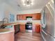 Kitchen features wood cabinets, stainless steel appliances, and a stainless steel sink at 2399 Coach Way, Jonesboro, GA 30236