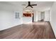 Spacious living room with hardwood floors, leading into an open kitchen area at 2399 Coach Way, Jonesboro, GA 30236