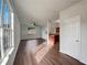 Open-concept living space with hardwood floors seamlessly connecting to the kitchen at 2399 Coach Way, Jonesboro, GA 30236