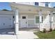 A close-up shot of the front porch and garage, showcasing the home's entrance and convenient parking at 2414 Rose Palm Pl, Atlanta, GA 30315