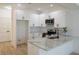 Bright kitchen with modern design, showcasing the counter space, cabinets, and stainless steel appliances at 2414 Rose Palm Pl, Atlanta, GA 30315