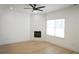Stylish living room featuring a modern fireplace, white shiplap, and ample natural light at 2414 Rose Palm Pl, Atlanta, GA 30315