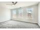 Spacious bedroom filled with natural light from multiple windows and a modern ceiling fan at 480 Rockwell Sw St, Atlanta, GA 30310