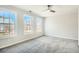 Bright bedroom with three windows, neutral carpet, and white walls at 480 Rockwell Sw St, Atlanta, GA 30310