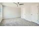 Spacious bedroom with neutral carpet, a ceiling fan, and natural light at 480 Rockwell Sw St, Atlanta, GA 30310