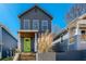 Charming two-story home with a bright green door and well-maintained landscaping at 480 Rockwell Sw St, Atlanta, GA 30310