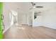Bright and airy living room with hardwood floors and a modern ceiling fan at 480 Rockwell Sw St, Atlanta, GA 30310