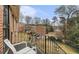 Cozy balcony features potted flowers and a peaceful view of the surrounding greenery at 135 E Hill St # 24, Decatur, GA 30030