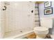 Bathroom featuring white subway tile in the shower, a toilet, and stylish decor at 135 E Hill St # 24, Decatur, GA 30030