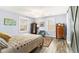 Comfortable bedroom featuring a ceiling fan, a quilt-patterned bedspread, and wood-look floors at 135 E Hill St # 24, Decatur, GA 30030