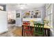 Bright dining room with hardwood floors, colorful chairs, and ample natural light, perfect for Gathering meals at 135 E Hill St # 24, Decatur, GA 30030