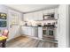 Well-lit kitchen with stainless steel appliances, white cabinetry, and a door leading to the outside at 135 E Hill St # 24, Decatur, GA 30030