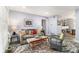 Cozy living room with a comfortable gray sofa, colorful rug, and lots of natural light at 135 E Hill St # 24, Decatur, GA 30030