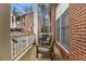 Inviting porch with two chairs, showcasing a cozy outdoor seating area with views of the building's exterior at 135 E Hill St # 24, Decatur, GA 30030
