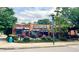 Exterior of Universal Joint with outdoor patio seating and colorful flowers at 135 E Hill St # 24, Decatur, GA 30030
