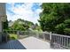 Back porch featuring gray floors and views of a well-manicured backyard at 2392 Ivy Mountain Dr, Snellville, GA 30078
