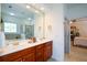 Bathroom with double sinks and a shower, adjacent to the main bedroom at 2392 Ivy Mountain Dr, Snellville, GA 30078