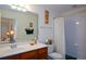 Bright bathroom with a vanity with double sinks, tub and shower combination at 2392 Ivy Mountain Dr, Snellville, GA 30078