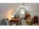 Bright bonus room featuring neutral walls, ceiling fan, and a large window with plenty of natural light at 2392 Ivy Mountain Dr, Snellville, GA 30078