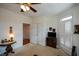 Bonus room featuring neutral carpet, a ceiling fan, and a television at 2392 Ivy Mountain Dr, Snellville, GA 30078
