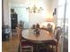 Traditional dining room with wood table, chairs, chandelier, and decorative accents at 2392 Ivy Mountain Dr, Snellville, GA 30078