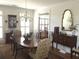 Dining room featuring hardwood floors, a chandelier, and classic furnishings at 2392 Ivy Mountain Dr, Snellville, GA 30078
