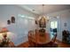 Cozy dining area with shuttered windows and a chandelier at 2392 Ivy Mountain Dr, Snellville, GA 30078