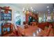 Elegant dining room features wood table with a vintage chandelier and built in shelving display at 2392 Ivy Mountain Dr, Snellville, GA 30078