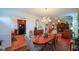 Elegant dining room featuring a chandelier and a wooden table with seating for six at 2392 Ivy Mountain Dr, Snellville, GA 30078