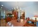 Open dining area with an adjacent kitchen and elegant lighting at 2392 Ivy Mountain Dr, Snellville, GA 30078