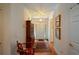 Warm and inviting foyer with hardwood floors, white trim, and a charming rug leading to the front door at 2392 Ivy Mountain Dr, Snellville, GA 30078