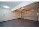 Spacious garage featuring an overhead light and a white door at 2392 Ivy Mountain Dr, Snellville, GA 30078