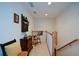 Hallway with carpet, trim, neutral walls, banister and staircase at 2392 Ivy Mountain Dr, Snellville, GA 30078
