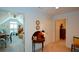 Hallway with carpet, trim, neutral walls, table and doorways to other rooms at 2392 Ivy Mountain Dr, Snellville, GA 30078