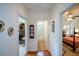 Hallway with hardwood floors leading to bedroom and bathroom, featuring neutral walls at 2392 Ivy Mountain Dr, Snellville, GA 30078