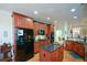 Well-equipped kitchen with center island, granite counters, and wood cabinetry at 2392 Ivy Mountain Dr, Snellville, GA 30078