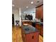 Well-appointed kitchen with granite counters, custom cabinets, and eat-in island at 2392 Ivy Mountain Dr, Snellville, GA 30078