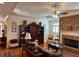 Inviting living room with a brick fireplace, hardwood floors, and classic furnishings at 2392 Ivy Mountain Dr, Snellville, GA 30078