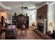 Open-concept living room with hardwood floors, fireplace, and detailed ceiling at 2392 Ivy Mountain Dr, Snellville, GA 30078