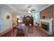 Comfortable living room showcasing a fireplace, hardwood floors, and classic decor at 2392 Ivy Mountain Dr, Snellville, GA 30078