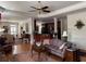 Open-concept living room with hardwood floors and a view into the kitchen at 2392 Ivy Mountain Dr, Snellville, GA 30078