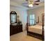 Cozy main bedroom featuring traditional furnishings, a ceiling fan, and soft natural light at 2392 Ivy Mountain Dr, Snellville, GA 30078