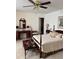 Spacious bedroom with a four-poster bed, side tables, and carpet floors at 2392 Ivy Mountain Dr, Snellville, GA 30078