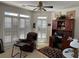 Bright office space with large windows, shutter blinds, and comfortable chair at 2392 Ivy Mountain Dr, Snellville, GA 30078